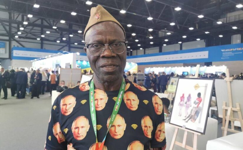 Guinea diplomat Lama Jaques Sevoba shows off Putin shirt at Russia-Africa summit