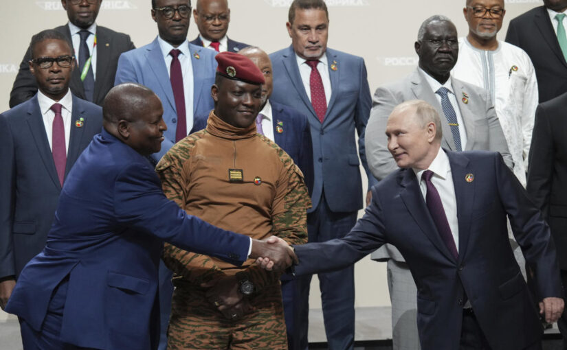 Putin woos African leaders at a summit in Russia with promises of expanding trade and other ties